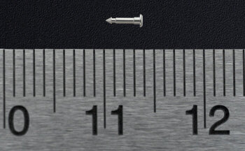 micro machined part along a ruler