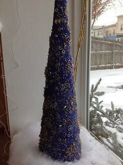 front window of the Micro Precision Components building with holiday decorations