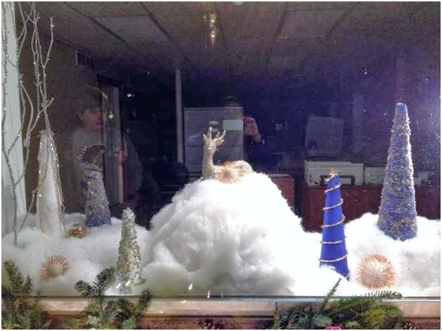 front window of the Micro Precision Components building with holiday decorations