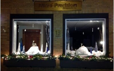 front window of the Micro Precision Components building with holiday decorations