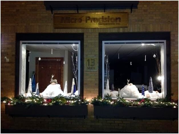 front window of the Micro Precision Components building with holiday decorations