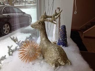 front window of the Micro Precision Components building with holiday decorations