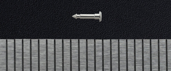 micro machined part along a ruler