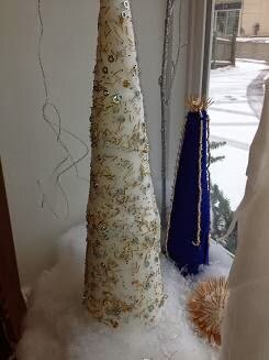 front window of the Micro Precision Components building with holiday decorations